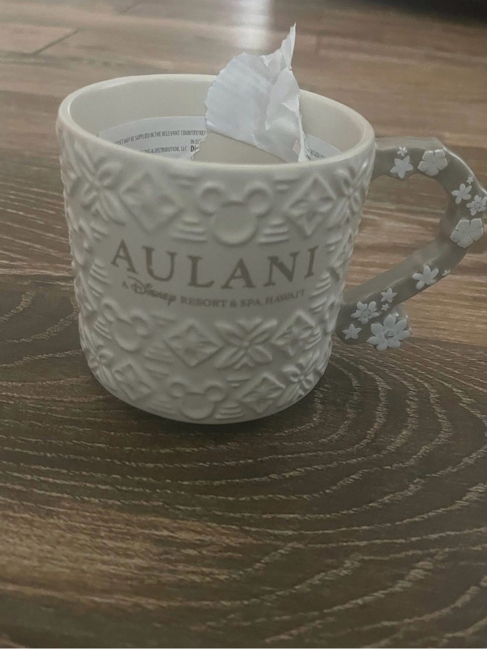 Disney Aulani Embossed Cream Ceramic Mug with Floral Handle